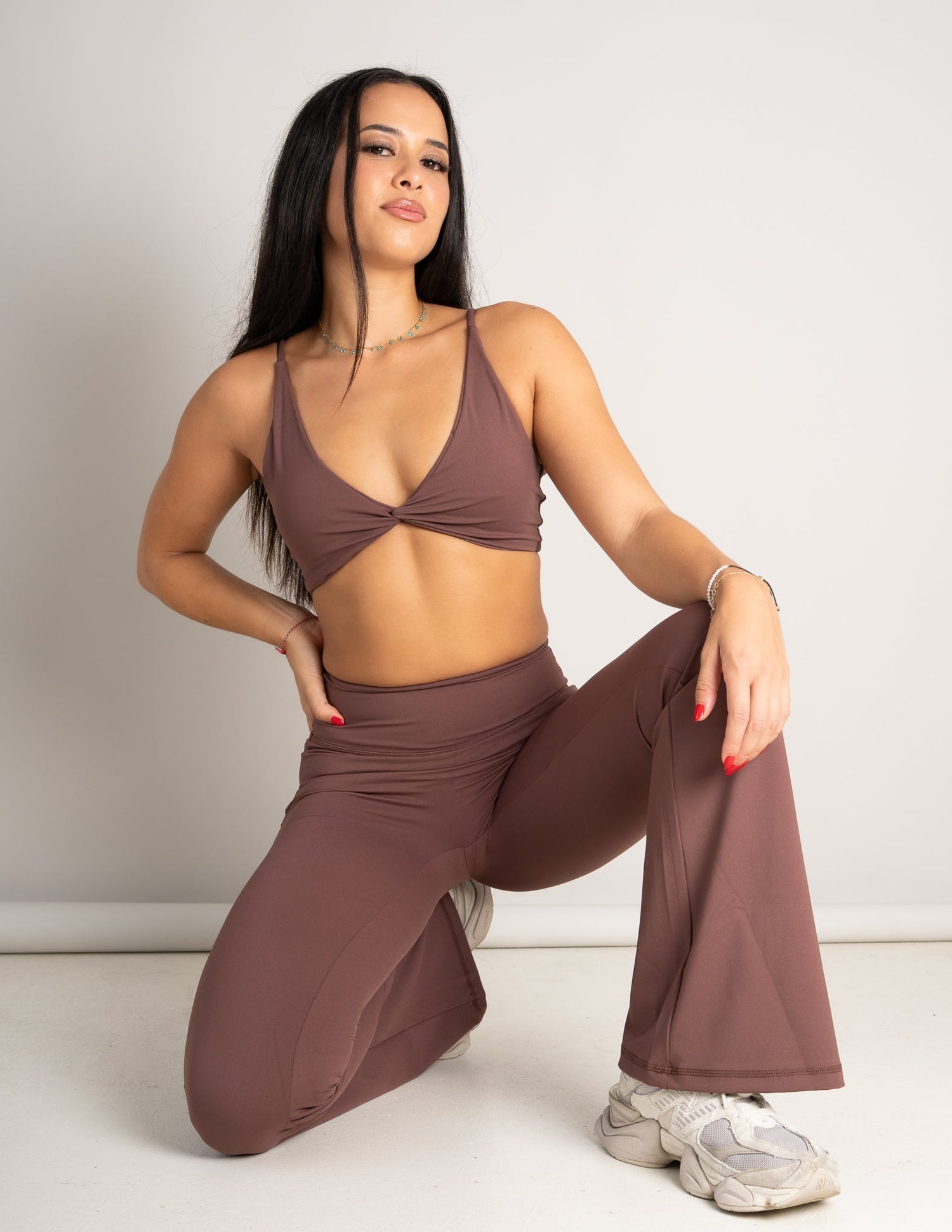 Model wearing Spark Twist Bra and Spark Leggings in Mocha - Barmelle