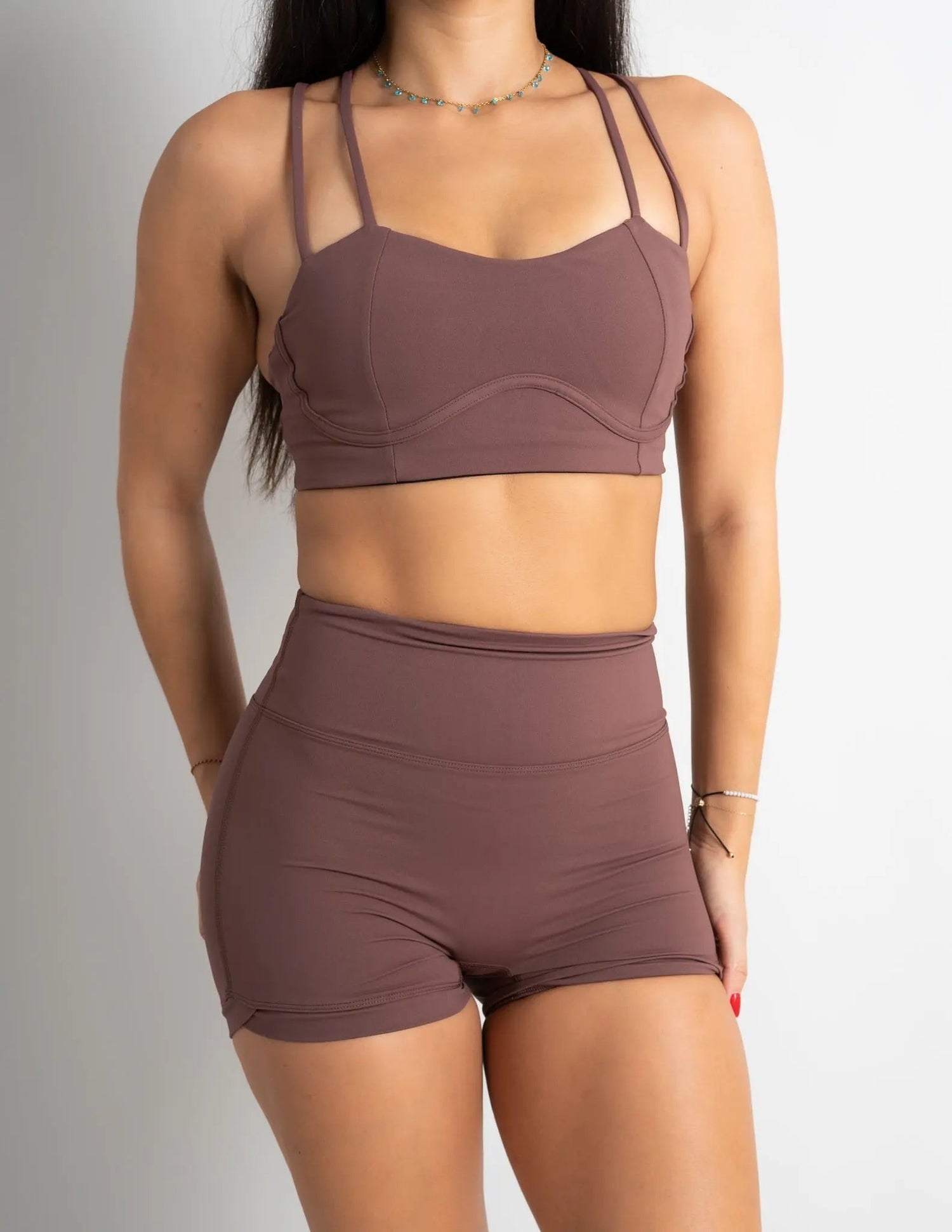 Model wearing Sculpt Sports Bra and Sculpt Scrunch Shorts in Mocha - Barmelle